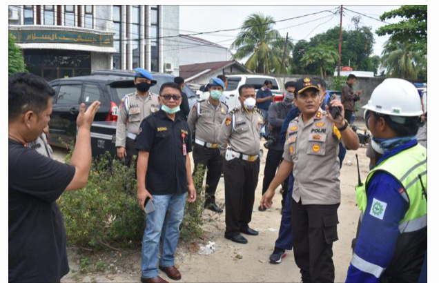 Polresta Pekanbaru Semprot Disinfektan Pakai Drone di Pemukiman Padat Penduduk